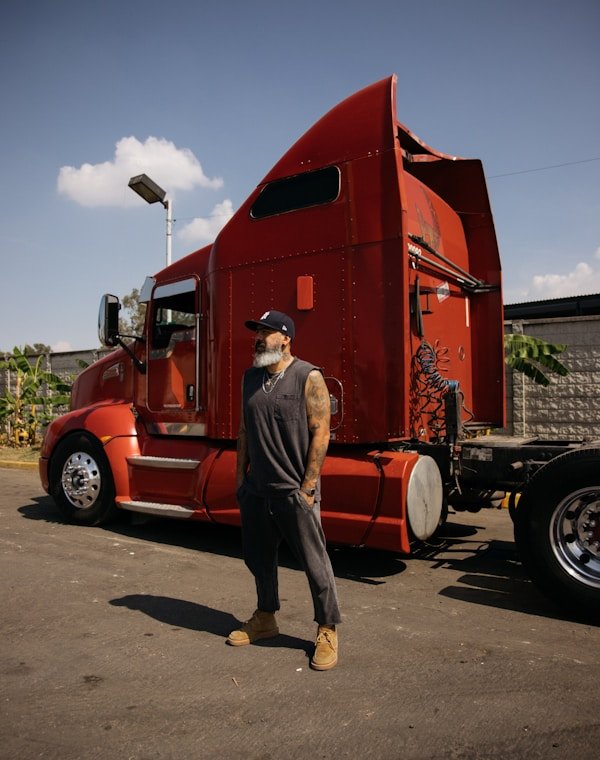 An owner-operator beside his rig